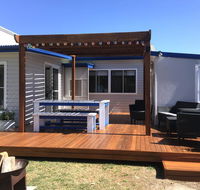Shellharbour Beach Cottage - walk onto Patrolled beach with flags in summer - Redcliffe Tourism